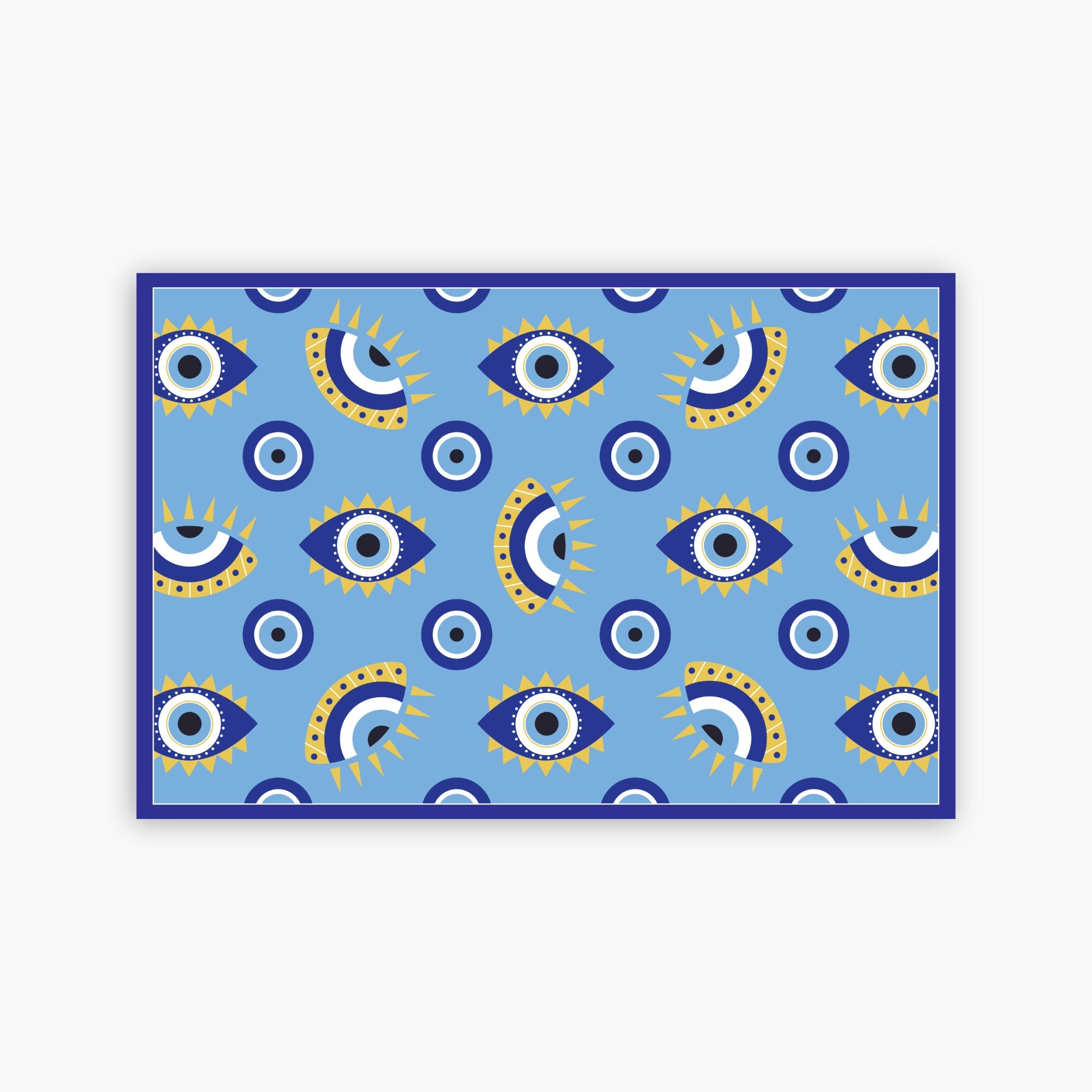 Patterned blue paper placemat with eye design on a blue background