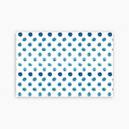 Pattern of blue watercolor dots on a white background printed on a paper placemat