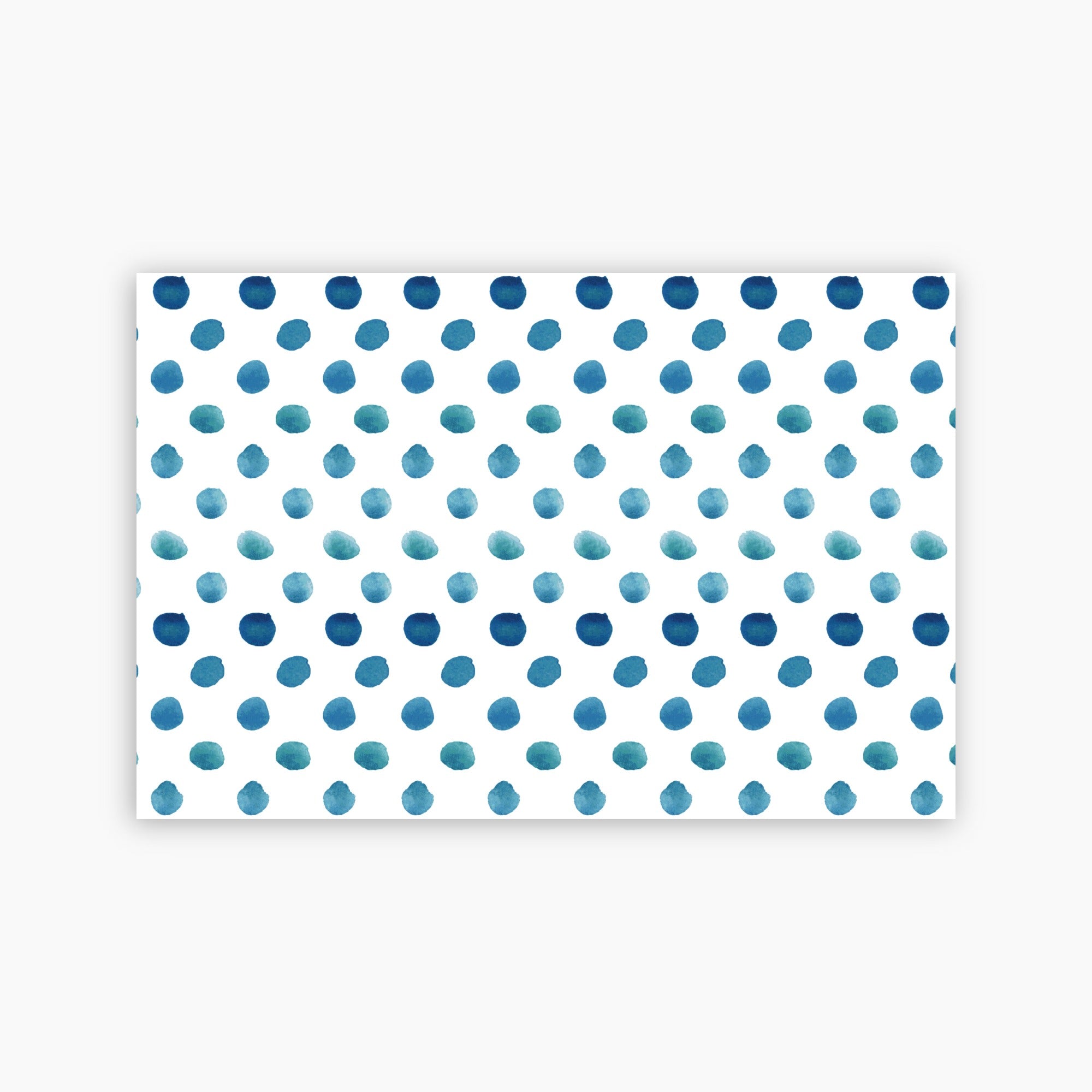 Pattern of blue watercolor dots on a white background printed on a paper placemat