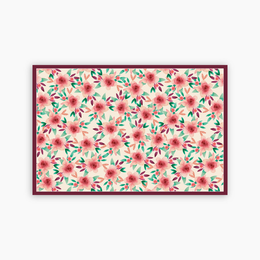 Floral patterned paper placemat with pink flowers and green leaves