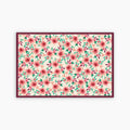 Floral patterned paper placemat with pink flowers and green leaves