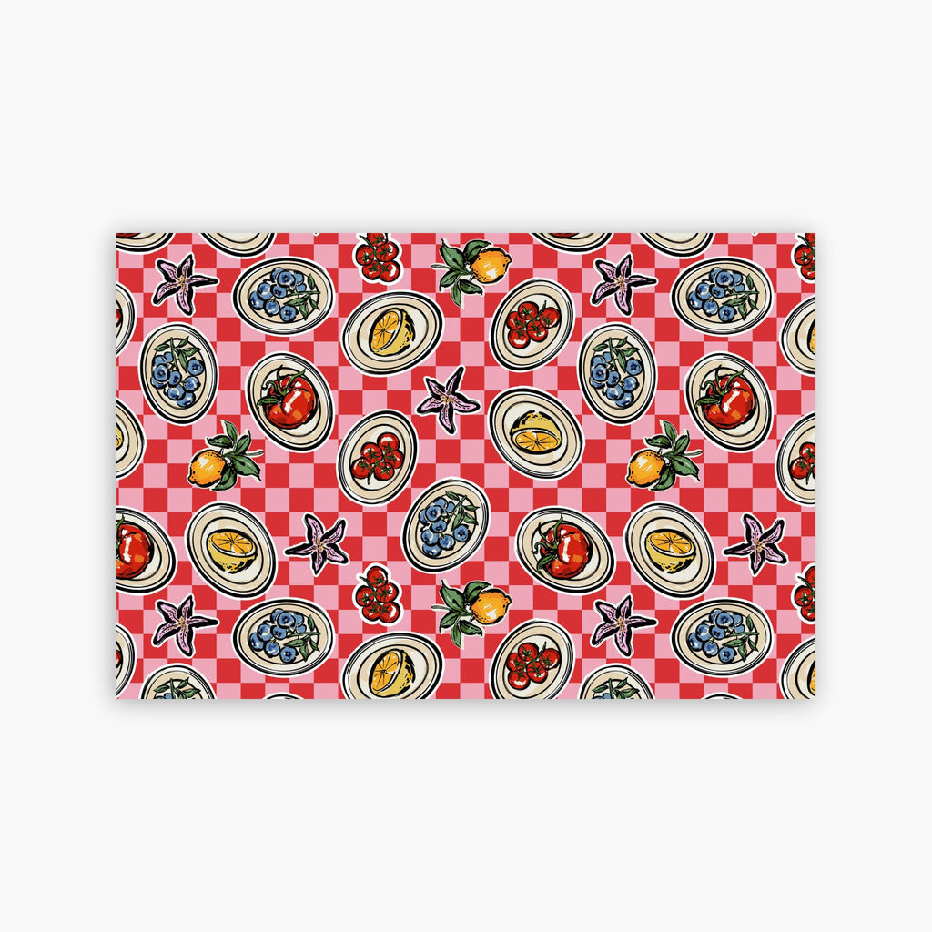 Patterned paper placemat with a red and white checkered background and various food illustrations on a white background
