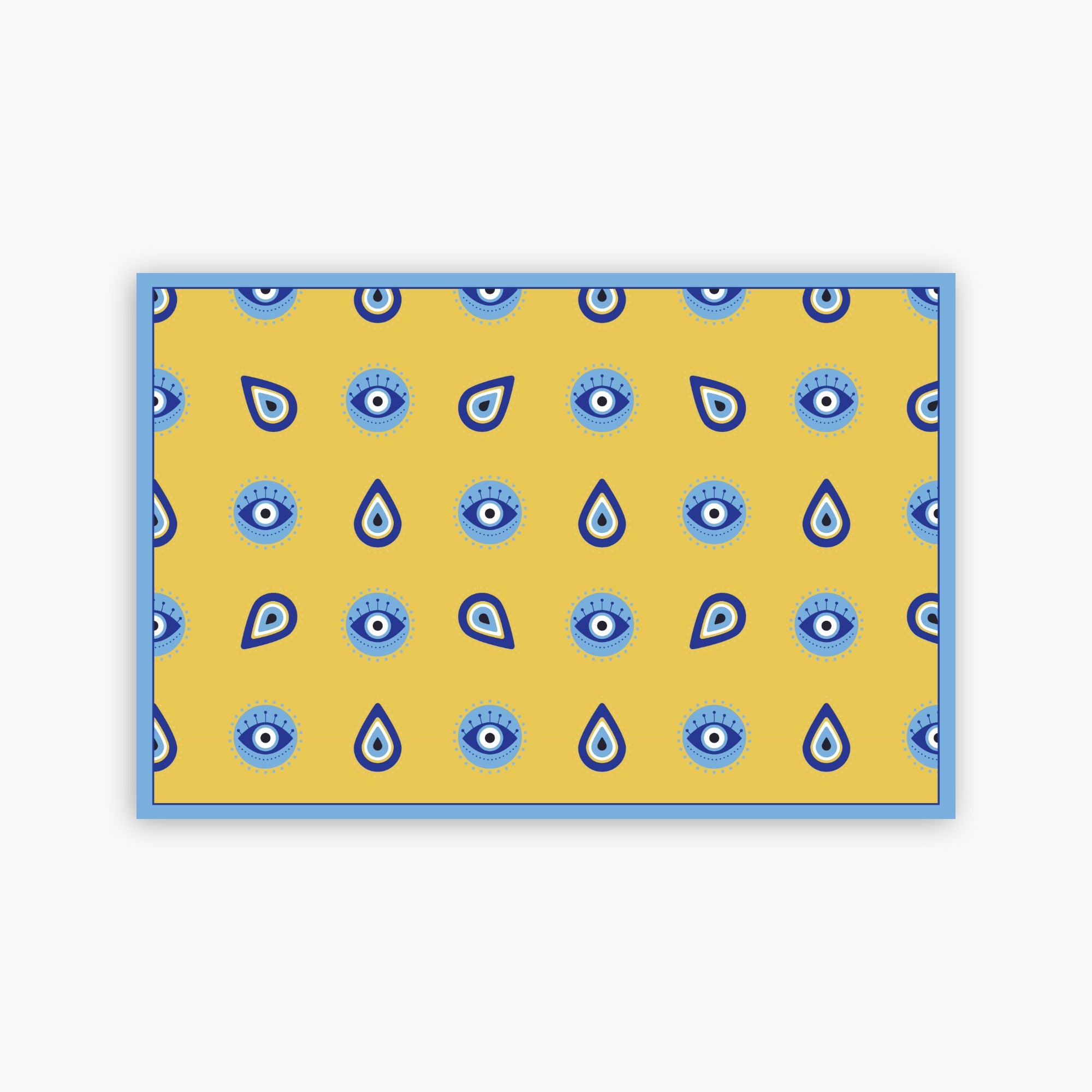 Yellow paper placemat with blue eye pattern on a white background