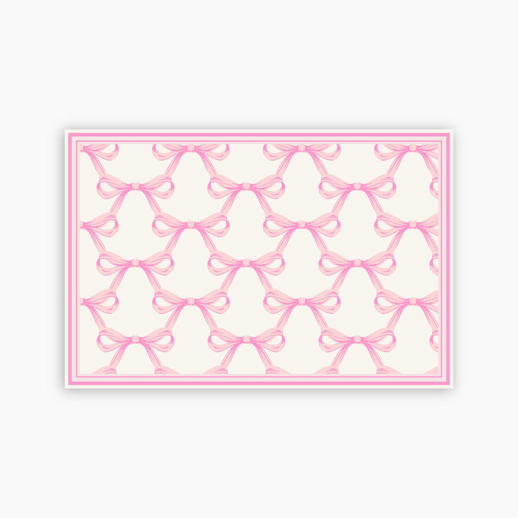 Pattern of pink bows on a white background