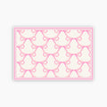 Pattern of pink bows on a white background