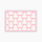 Pattern of pink bows on a white background
