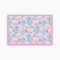 Floral patterned fabric with pink flowers on a blue background