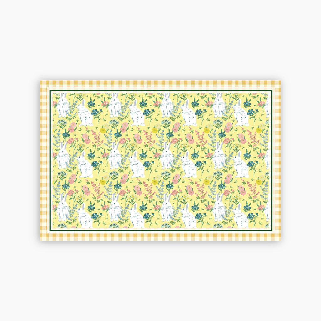 Patterned paper with bunnies and flowers on a yellow background