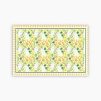 Patterned paper with bunnies and flowers on a yellow background