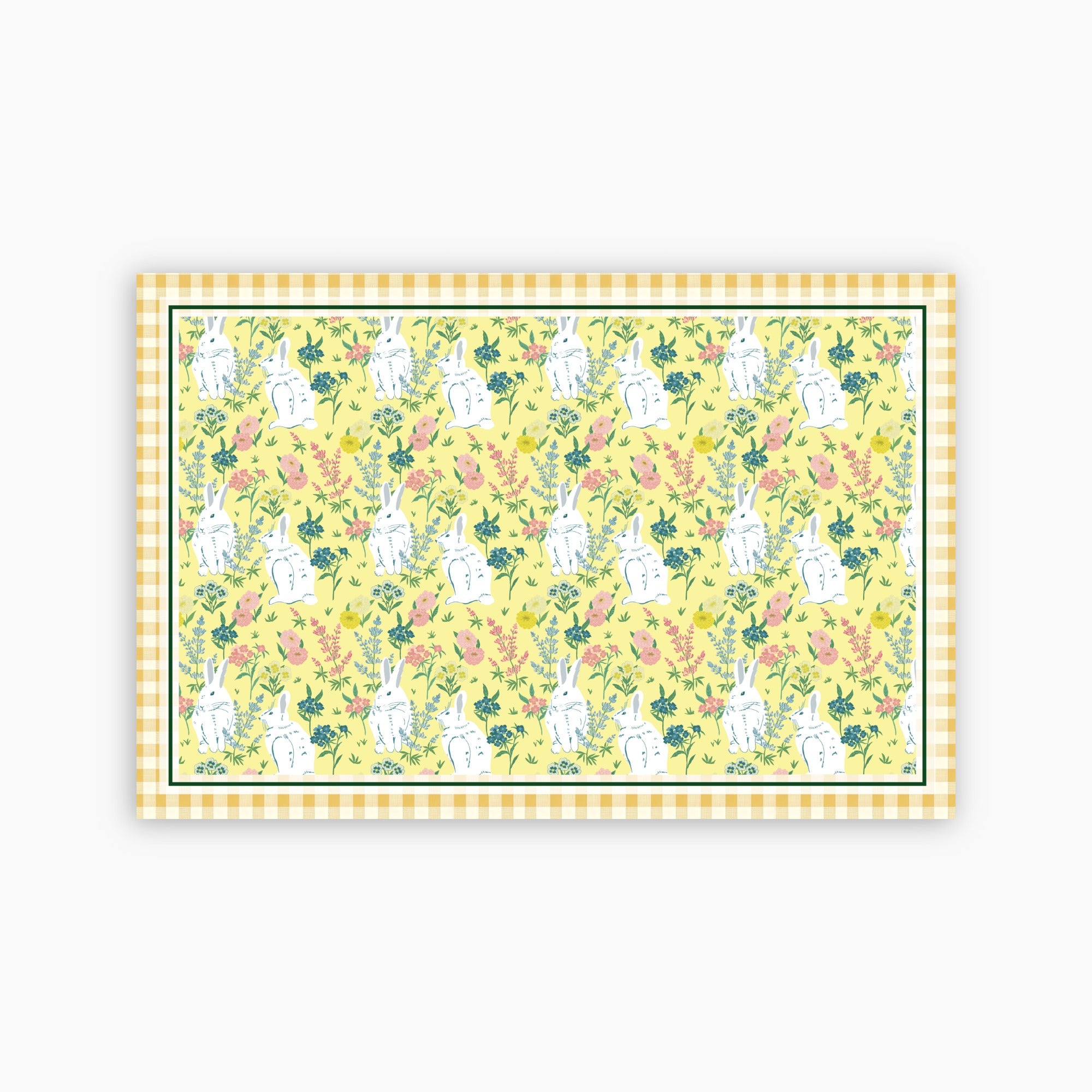Patterned paper with bunnies and flowers on a yellow background