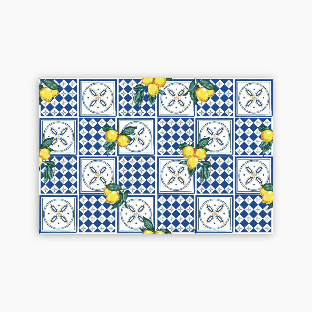 Pattern of blue and white tiles with yellow lemons on a white background